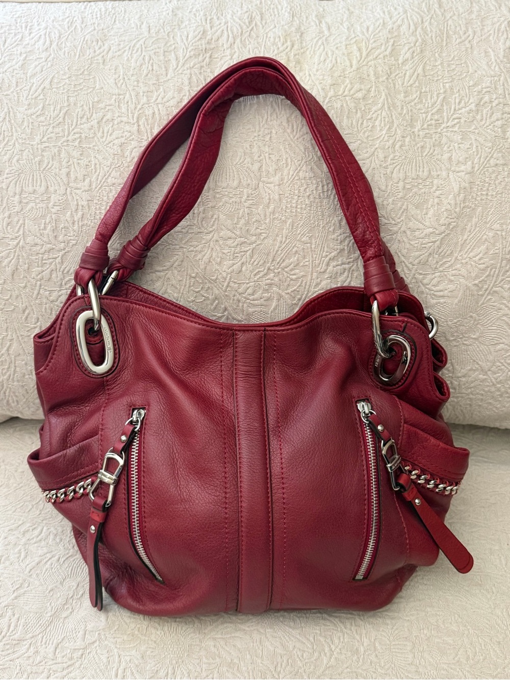 B. Makowsky Red Leather Shoulder Bag with silver detail.